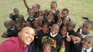 Kenyan children repping for the cause with their "World Peace Before 2021" tee-shirts.  